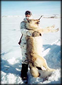 Stacy Hull shows off a wolf he bagged.