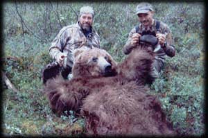 John Frick (left) of Florence, MT with his traditional Archery Brown Bear, "Old Four Toes".